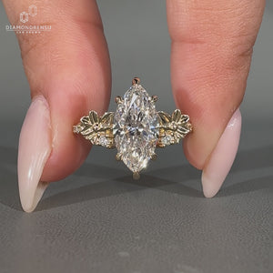 Lab grown marquise cut ring with pave band and prongs.