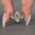Lab grown marquise cut ring with pave band and prongs.