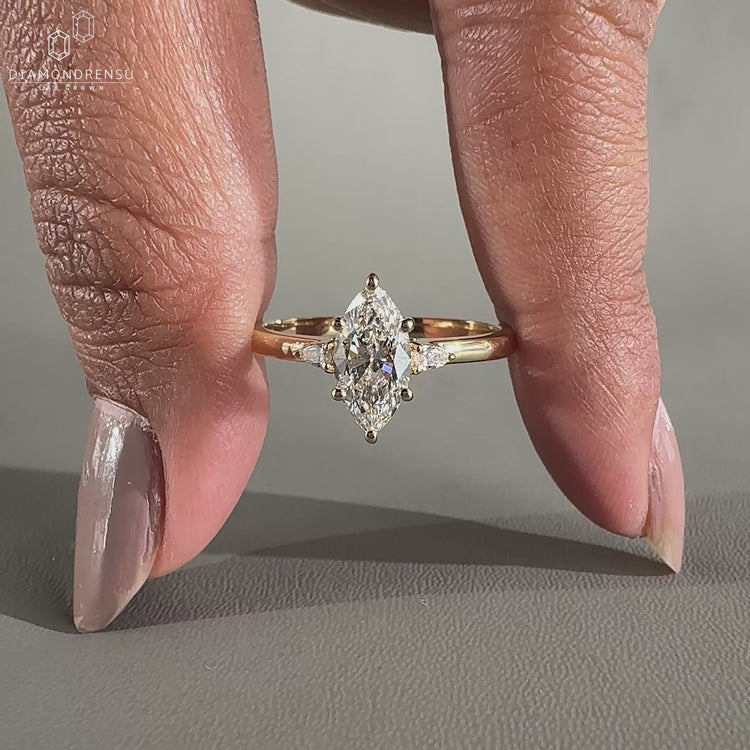 Marquise Three Stone Engagement Ring designed with elegance.
