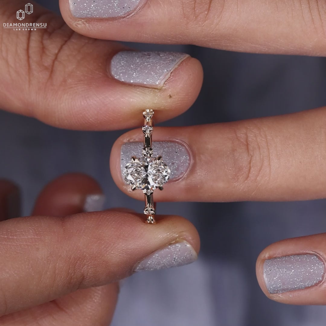 Close-up of an oval engagement ring with hidden halo, highlighting the Diamond Distance Pave design.