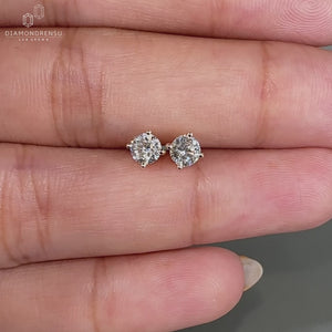 Stunning round diamond stud earrings for everyday glamour.
