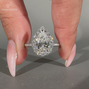 Handmade pear cut diamond ring with three claw prong design.