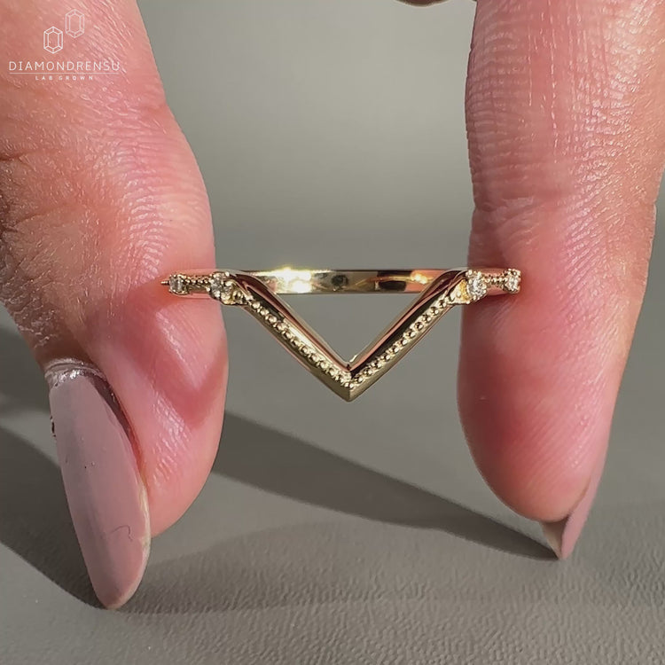 V Shaped Wedding Band featuring intricate detailing.
