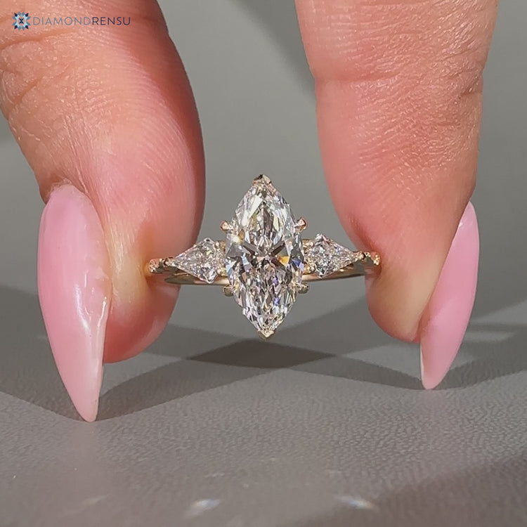 Marquise center stone paired with kite side stones and three stone style.