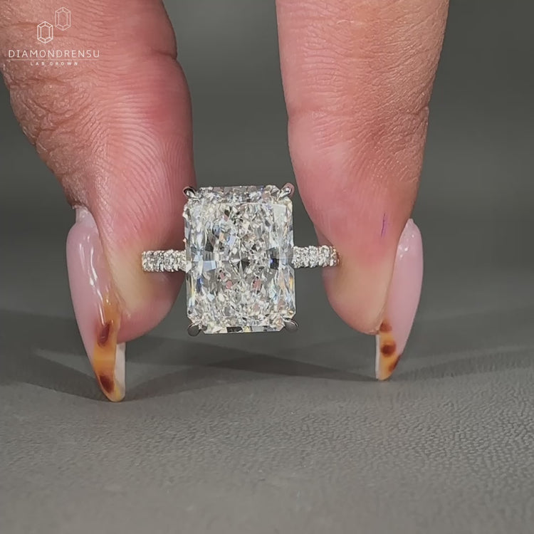 Pave setting ring crafted with shimmering side diamonds for extra brilliance.
