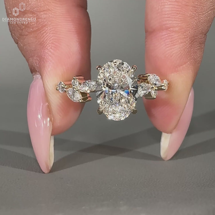 4 prong setting handmade ring with an oval diamond centrepiece.