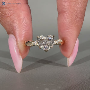 Twisted shank with round accents paired with V prong setting.