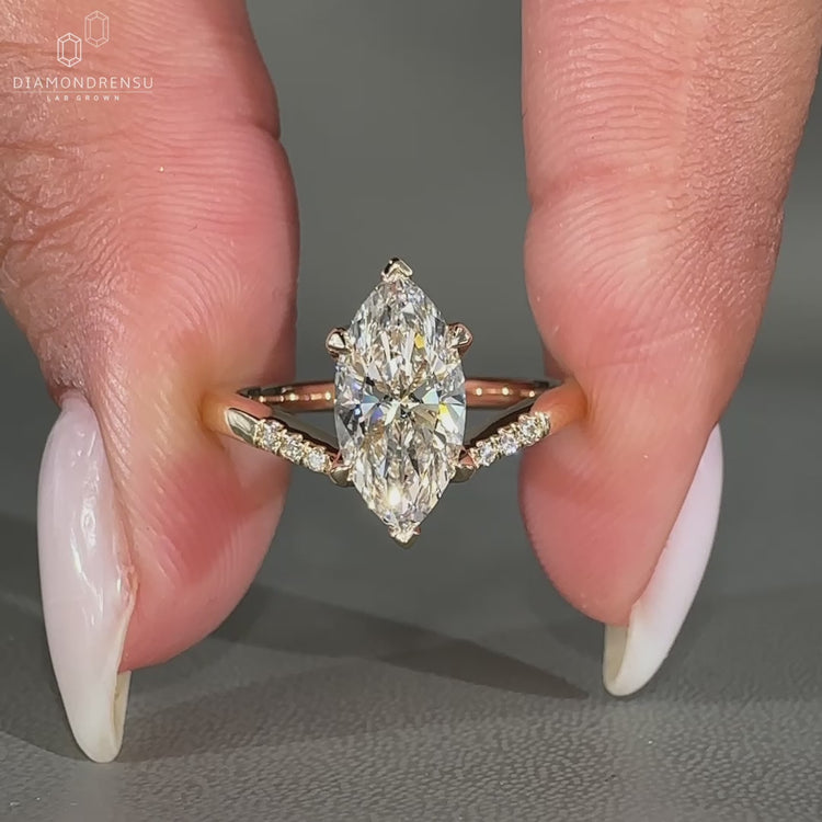 Lab grown diamond in a bold yellow gold V shaped setting.
