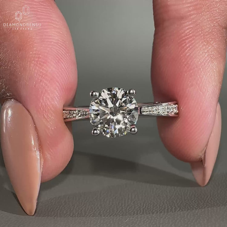 Round Cut Diamond Ring in a timeless cathedral ring style.