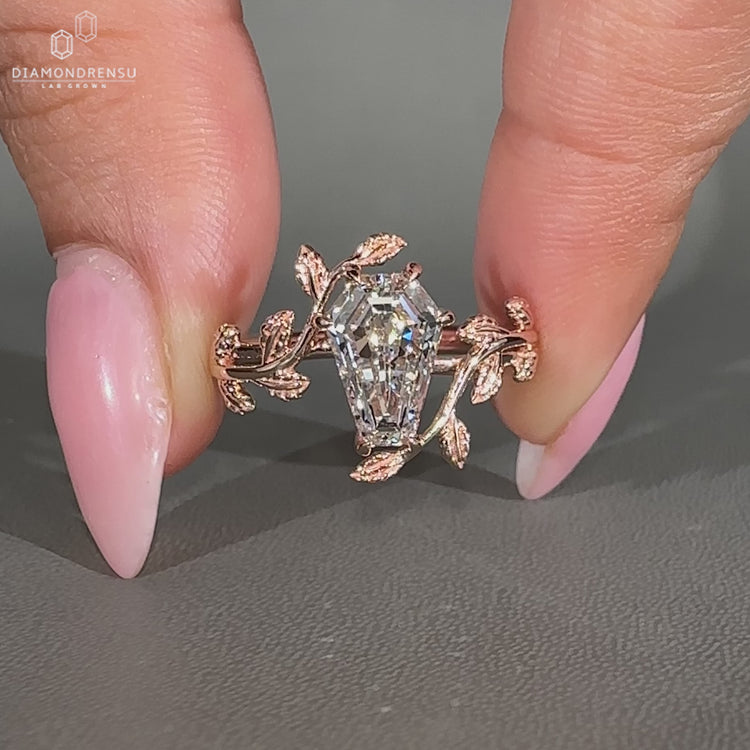 Lab grown coffin diamond ring with bypass setting and six claw prongs.