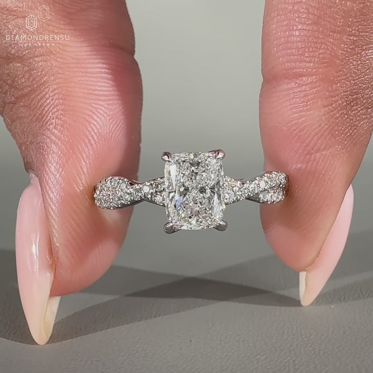 Elongated cushion engagement ring featuring lab grown diamonds.
