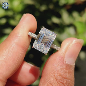 Hidden halo moissanite ring sparkling under soft lighting.
