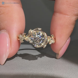 Round center diamond ring with round side stones.