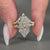 Marquise side stones complement this Dutch marquise wedding ring.