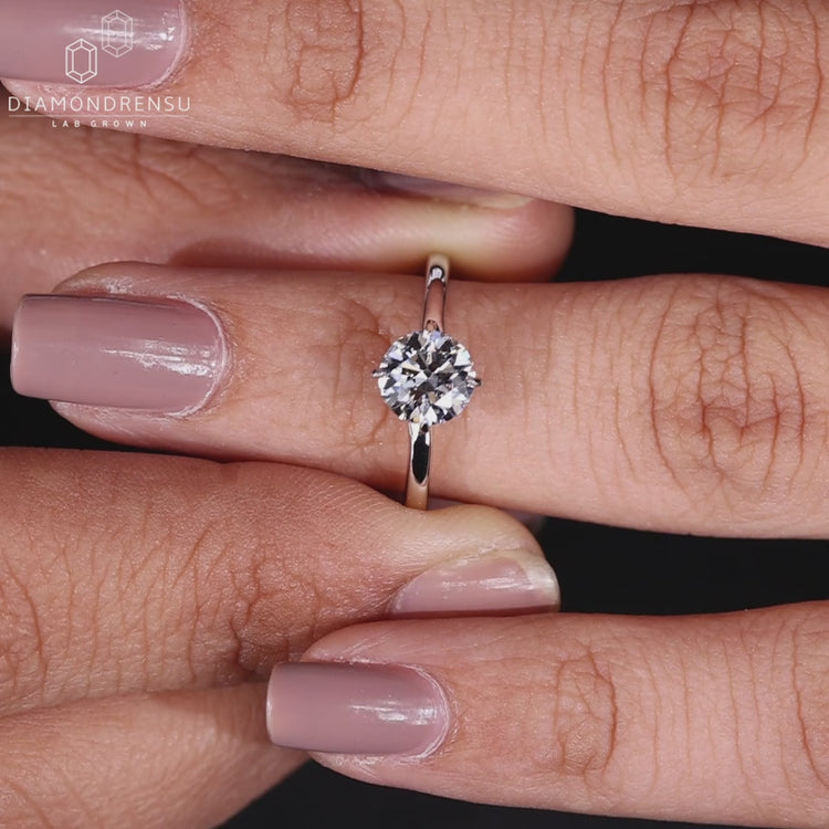 IGI Certified Round Diamond in a solitaire engagement ring.