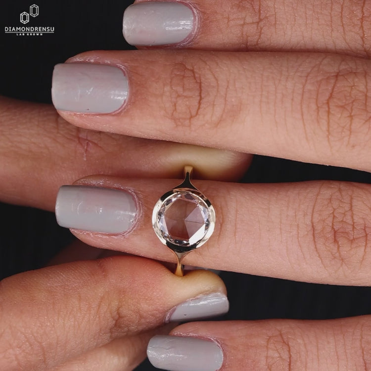 Elegant rose cut diamond ring with intricate detailing.
