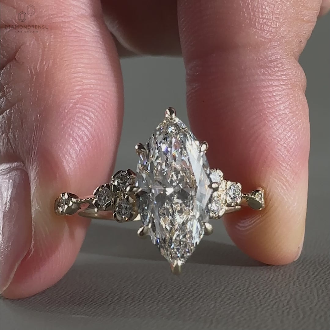 Close-up of a marquise diamond engagement ring, highlighting its unique cut and dazzling shine.