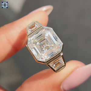 Asscher cut moissanite ring set in a unique bezel setting for elegance.
