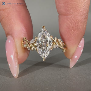 Lab grown marquise diamond ring with marquise and round side stones.