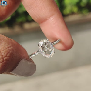 The pave setting adds continuous sparkle around the gemstone.
