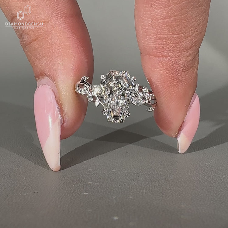 Lab grown coffin diamond ring with marquise and round side stones.