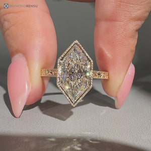 Dutch marquise center stone paired with a bezel setting.