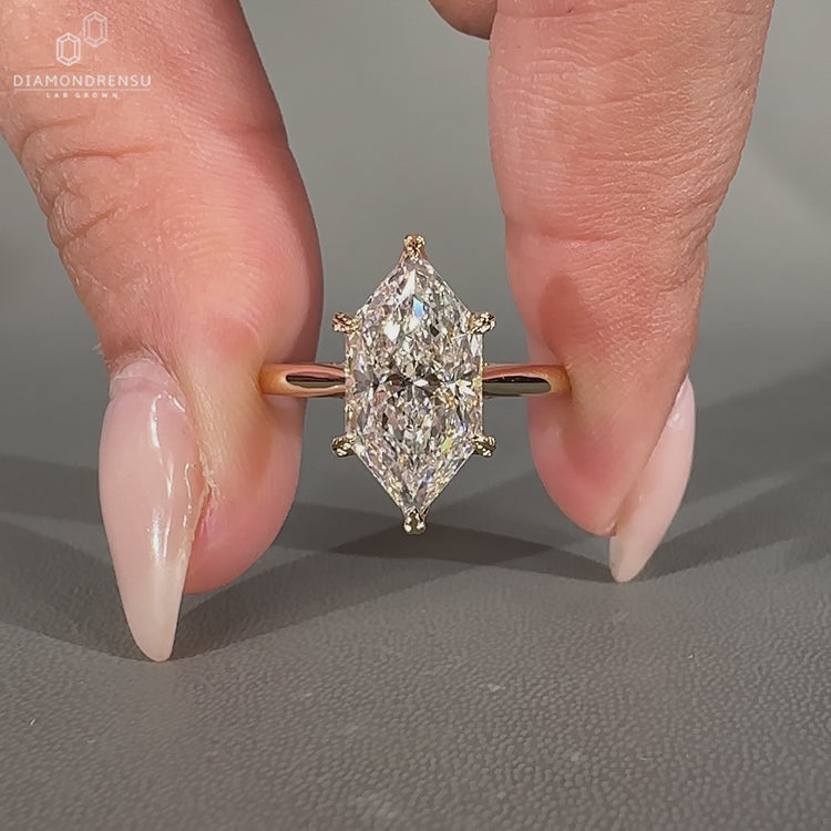 Dutch marquise engagement ring featuring a leaf style prong design.
