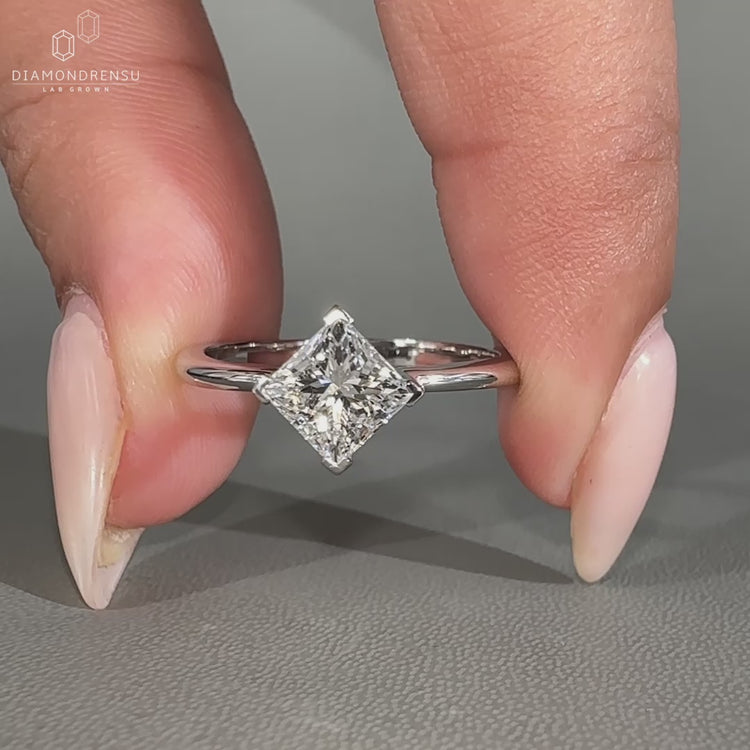 V prong setting secures the diamond with delicate strength.
