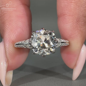 Vintage style cushion old european diamond ring with knife edge shank.
