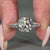 Vintage style cushion old european diamond ring with knife edge shank.
