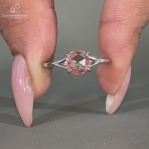 Pink diamond engagement ring featuring a sophisticated and vibrant design.

