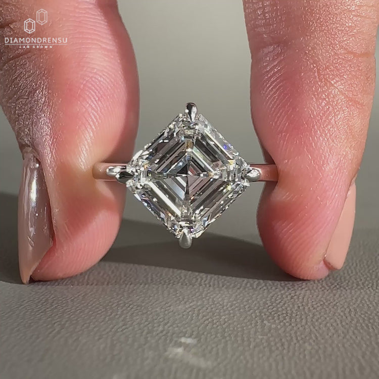 Asscher cut ring with compass prong setting

