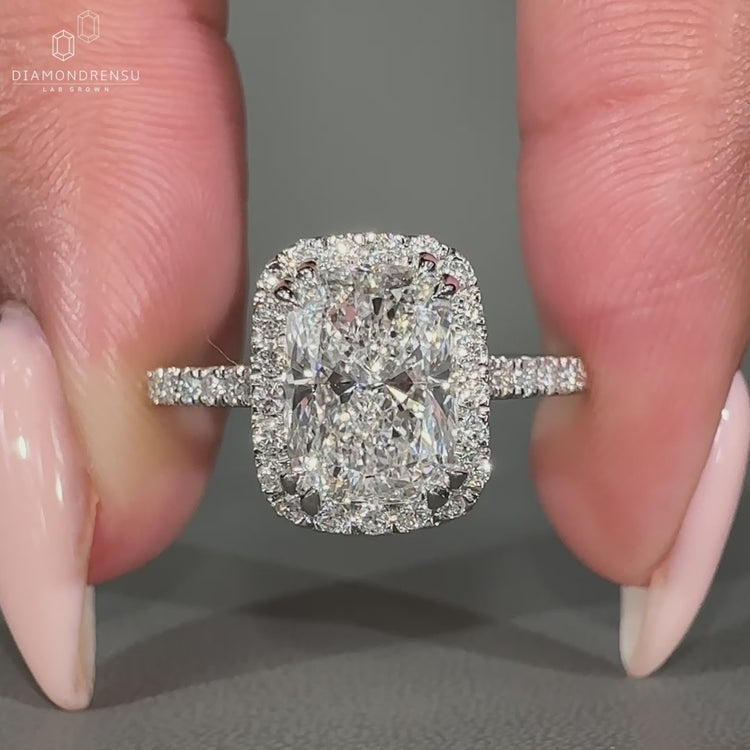 Sparkling halo ring with center diamond and surrounding stones.
