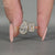 Pear and emerald toi et moi engagement ring bezel set.