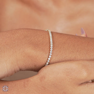Round diamond tennis bracelet for women.
