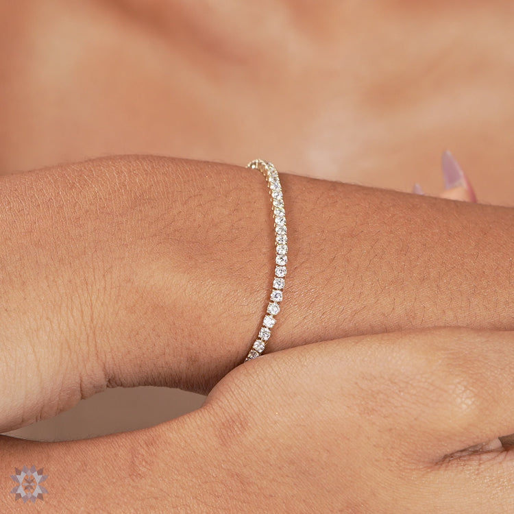 Round diamond tennis bracelet for women.
