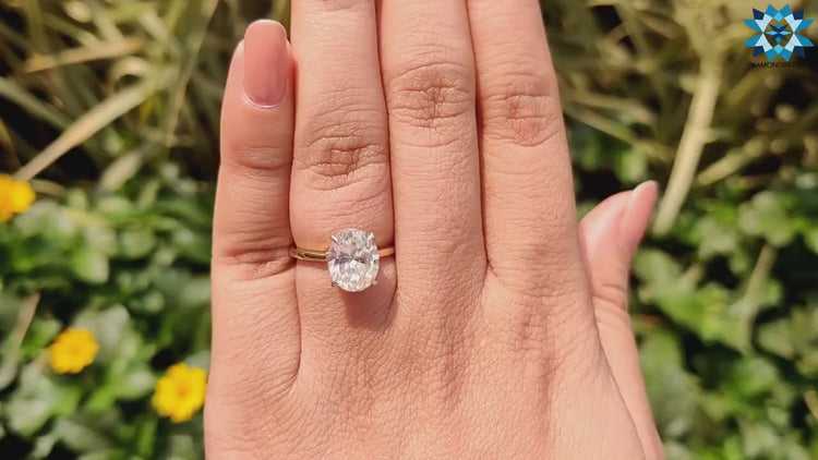 Two-tone metal moissanite engagement ring.