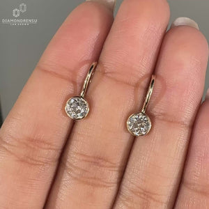 Old European cut diamond earrings with vintage charm.
