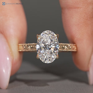 Oval center stone paired with vintage style and milgrain details.