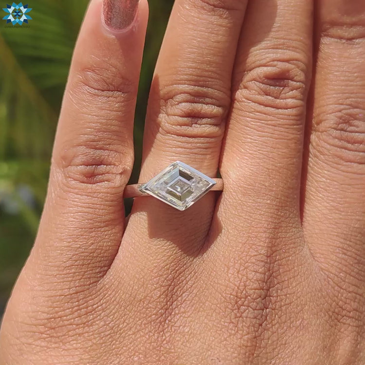 East to west moissanite ring in white gold.