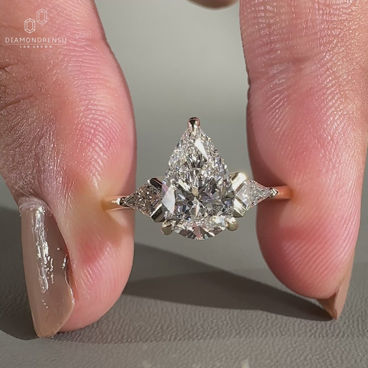 Three Stone Ring featuring unique diamond side stones.