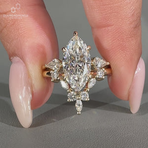 Kite side stones complement this marquise cut wedding ring.