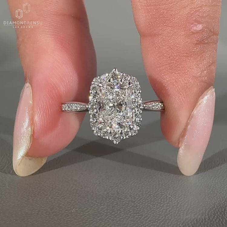 Handmade white gold engagement ring with cathedral setting.
