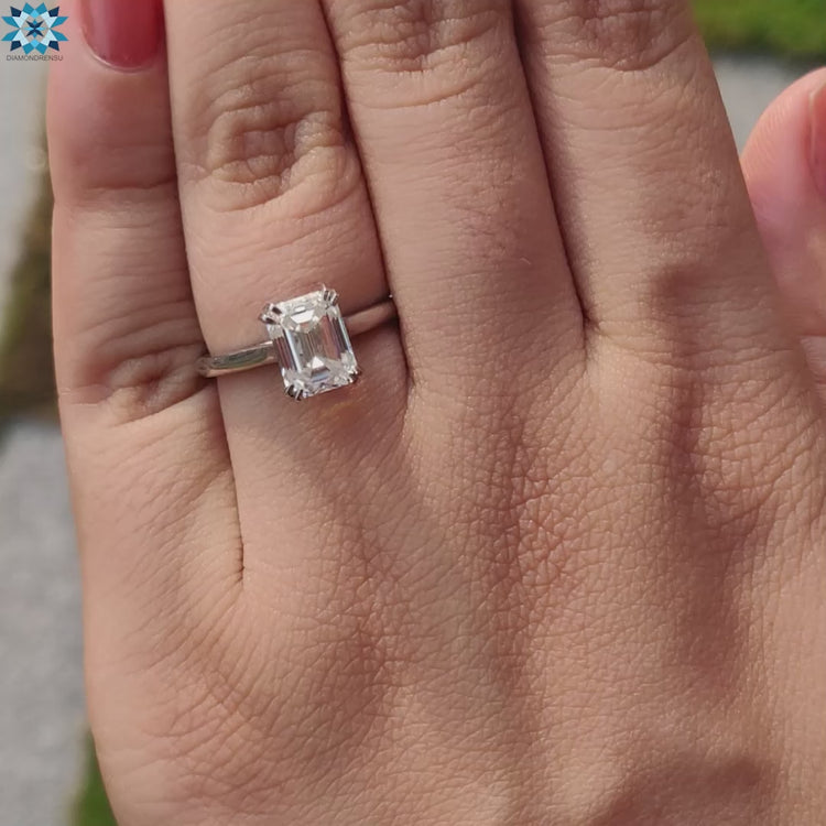 Stunning emerald step cut moissanite with sleek edges.
