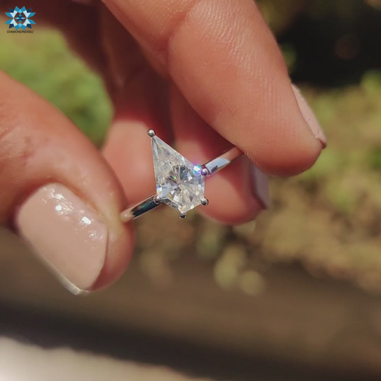 White gold ring showcasing a stunning spear cut moissanite for a timeless look.
