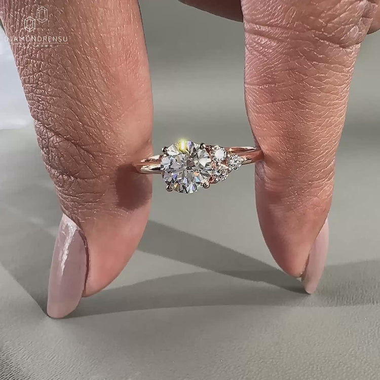 An elegant asymmetrical ring engagement in rose gold for a timeless proposal.
