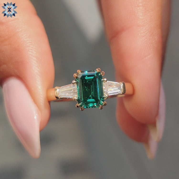 Elegant 3 Stone Engagement Ring featuring a Green Moissanite center in a classic setting.
