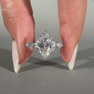 Nature inspired ring featuring marquise cut diamonds and shared prong setting.
