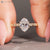Oval nature inspired diamond ring with a six claw prong setting.