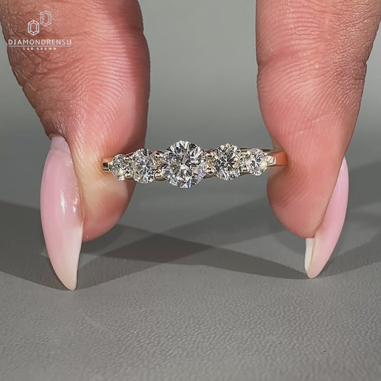 Five stone diamond wedding band with round diamonds.
